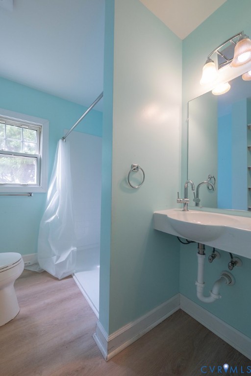 1881 Fairport Road Reedville, VA 22539 - Photo 29 of 54 Wall-mounted sink with chrome fixtures, wood-finis