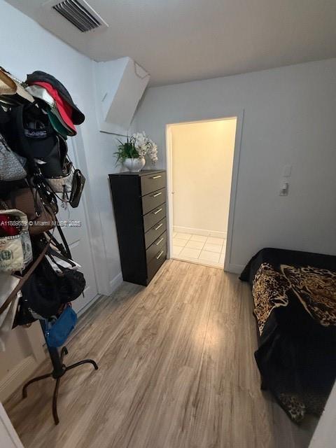 276 East 12th Street Hialeah, FL 33010 - Photo 12 of 25 a bedroom with a bed and a dresser