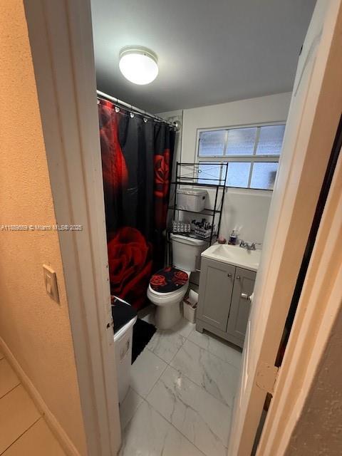 276 East 12th Street Hialeah, FL 33010 - Photo 17 of 25 a bathroom with a toilet and a shower