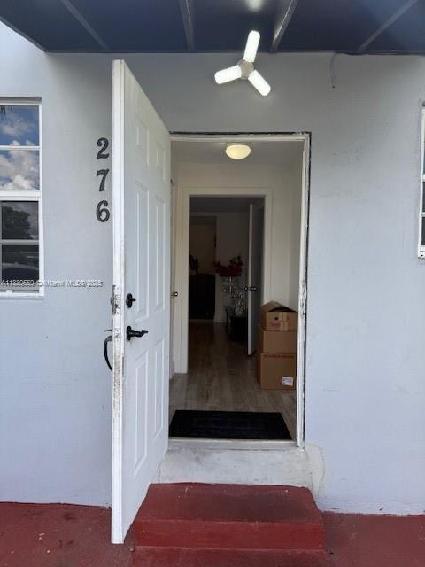 276 East 12th Street Hialeah, FL 33010 - Photo 2 of 25 a view of a hallway view with wooden floor and staircase
