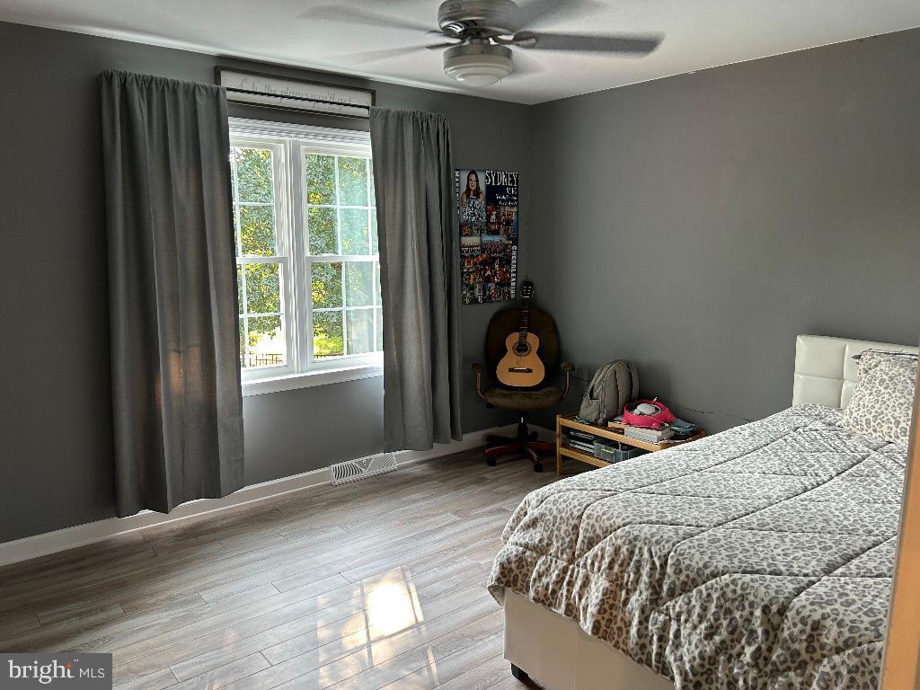 106 Hammersmith Lane Lititz, PA 17543 - Photo 14 of 28 a bed sitting in a bedroom next to a window