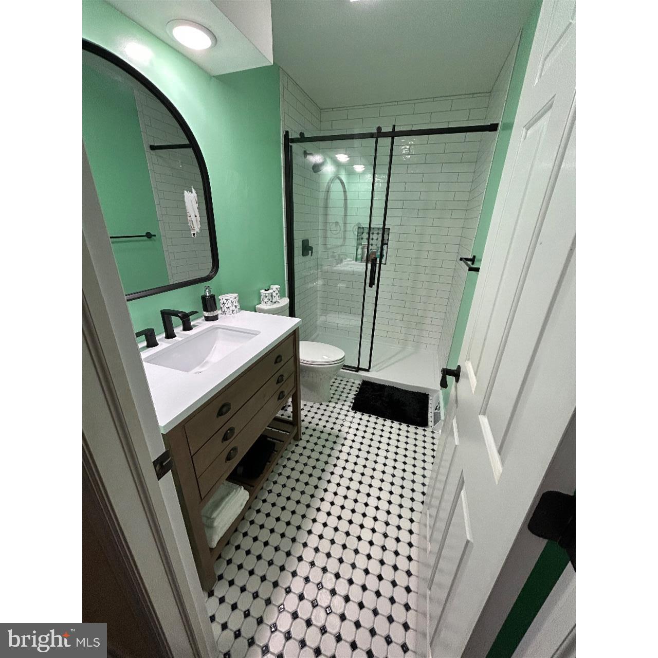 106 Hammersmith Lane Lititz, PA 17543 - Photo 16 of 28 a bathroom with a sink a toilet and a mirror