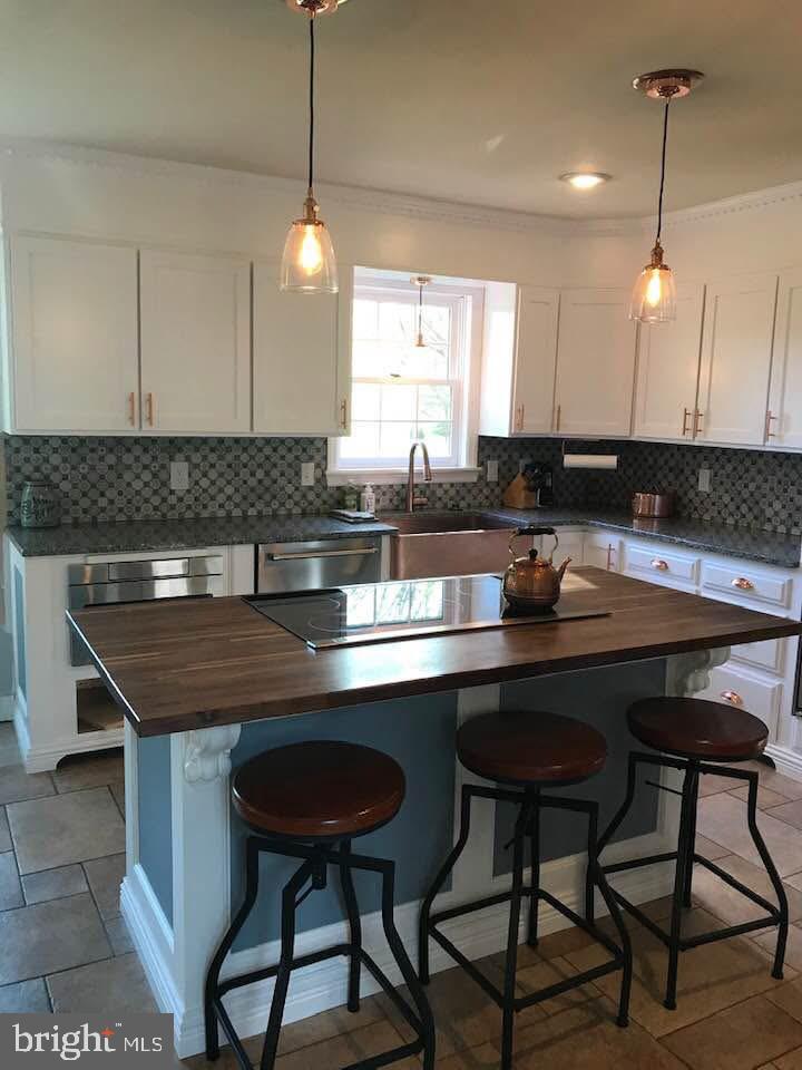 106 Hammersmith Lane Lititz, PA 17543 - Photo 10 of 28 a kitchen with a table chairs stove and cabinets
