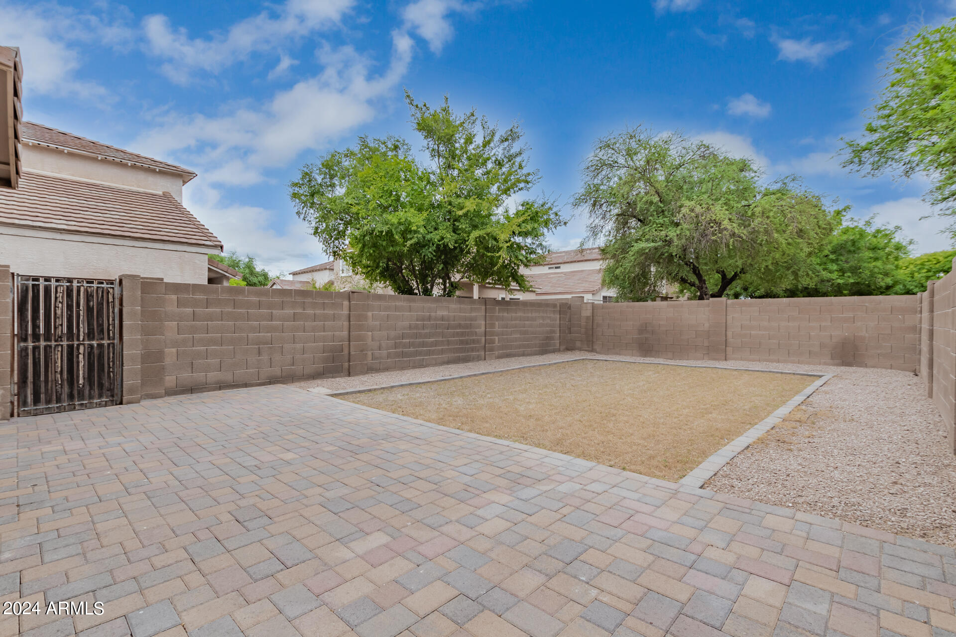 1371 South Boulder Street, Unit A Gilbert, AZ 85296 - Photo 41 of 43 a view of a backyard