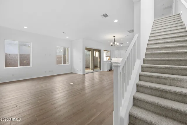 a view of an entryway with wooden floor