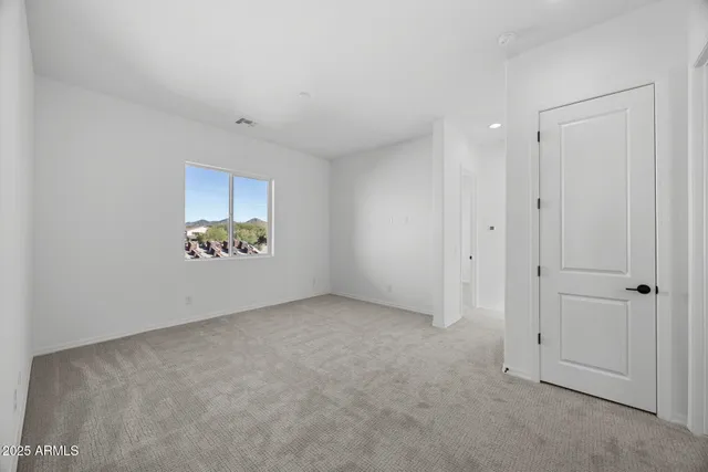 a bathroom with a toilet a sink a mirror and a bathtub