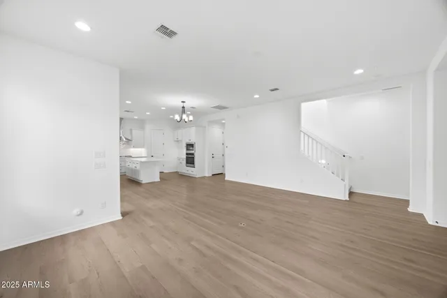 a view of a kitchen with a sink and a window
