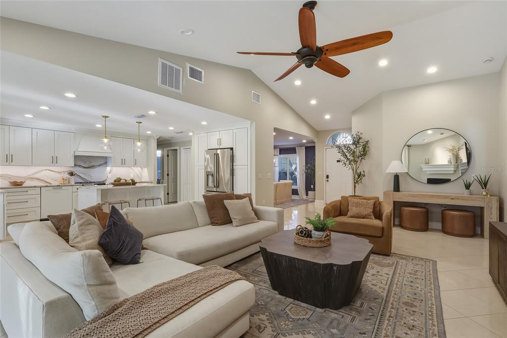 5475 Saddlebrook Way Wesley Chapel, FL 33543 - Photo 2 of 29 a living room with furniture and a view of kitchen