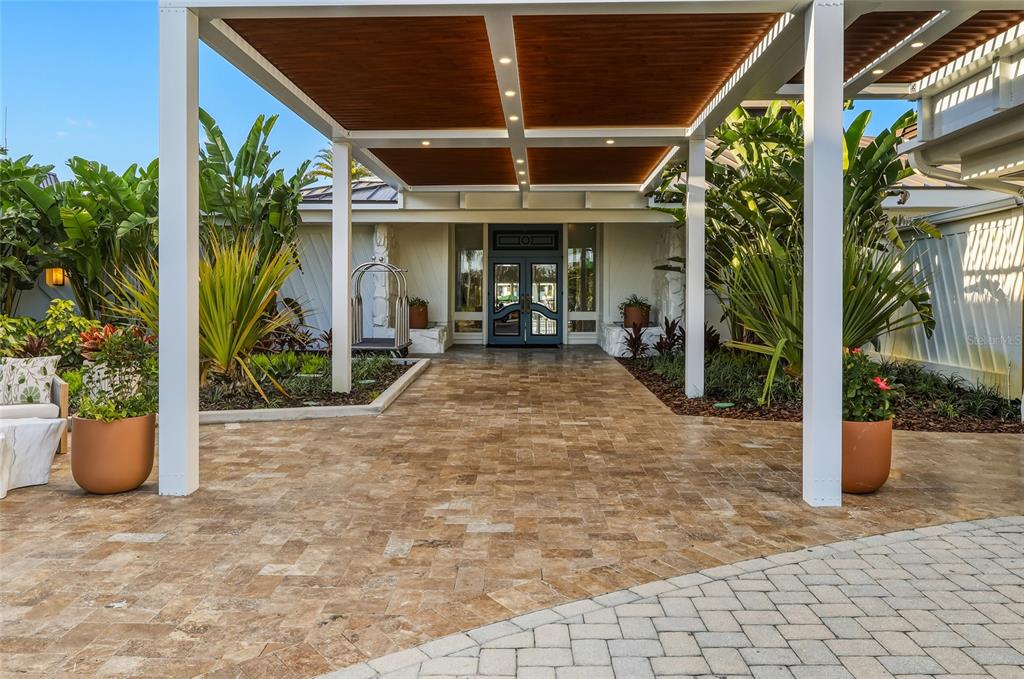 5475 Saddlebrook Way Wesley Chapel, FL 33543 - Photo 22 of 29 a view of a house with porch and potted plants