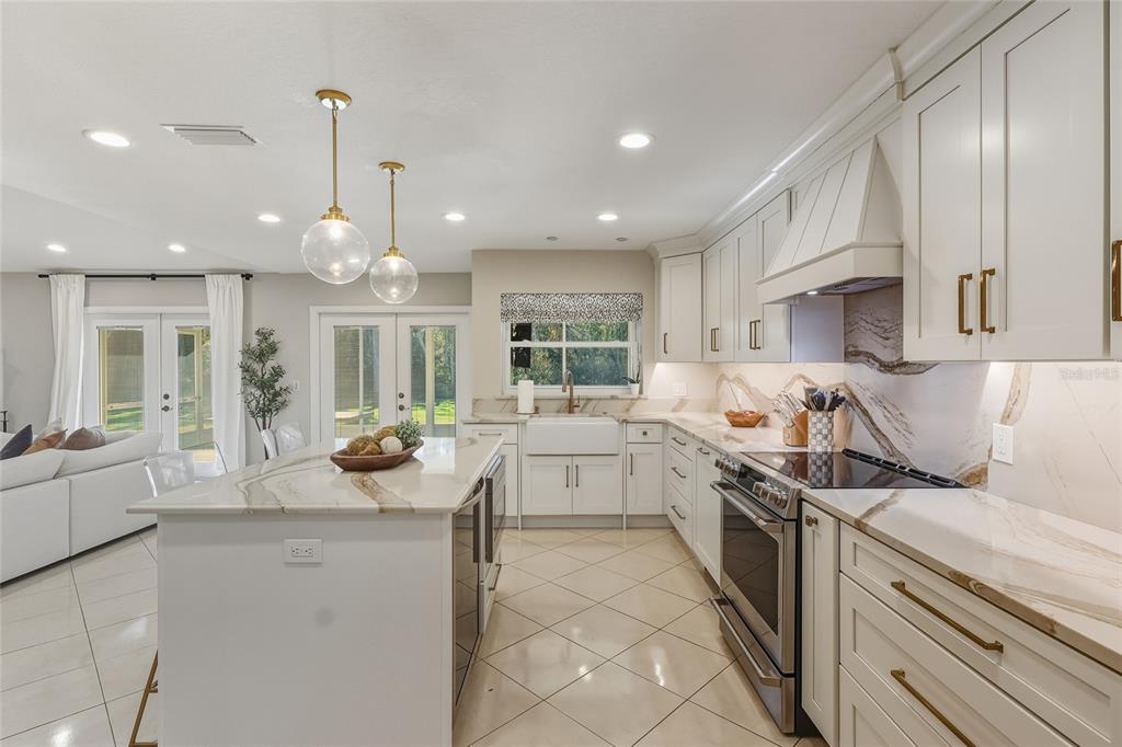 5475 Saddlebrook Way Wesley Chapel, FL 33543 - Photo 7 of 29 a kitchen with a sink stove and cabinets