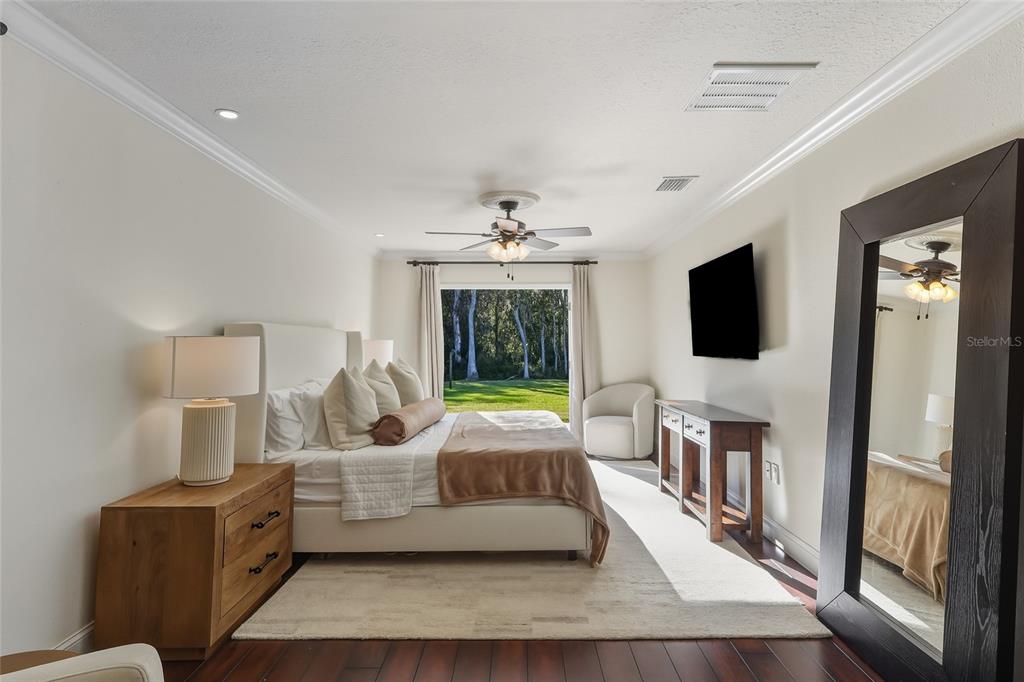 5475 Saddlebrook Way Wesley Chapel, FL 33543 - Photo 9 of 29 a bedroom with furniture and flat screen tv