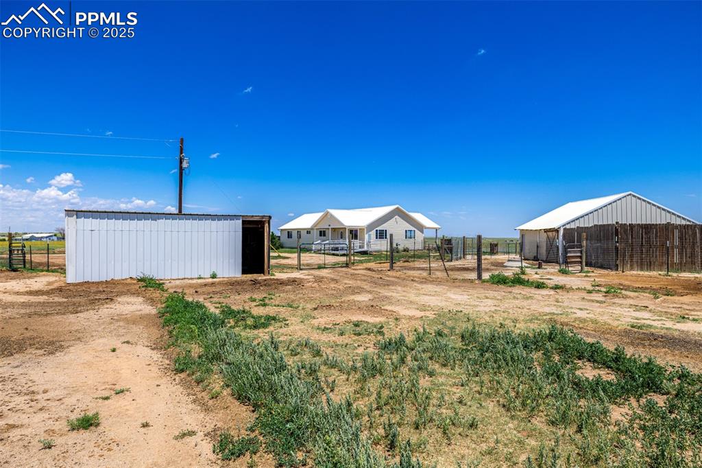 6065 Mulberry Road Calhan, CO 80808 - Photo 31 of 45 View of yard with an outbuilding