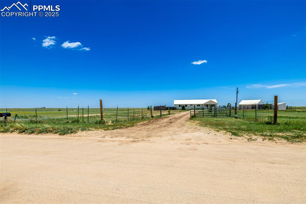 6065 Mulberry Road Calhan, CO 80808 - Photo 33 of 45 View of yard featuring a view of rural / pastoral area