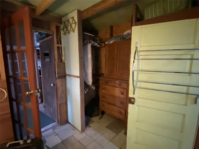 a kitchen with a stove and a wooden floor