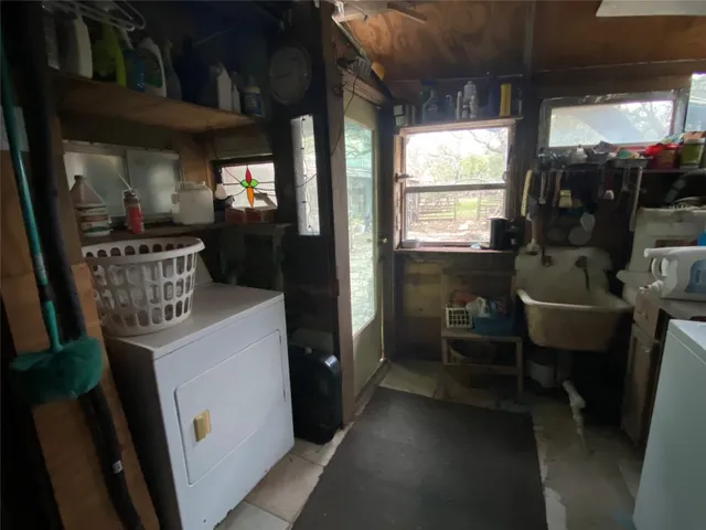 a view of a livingroom with furniture window and wooden floor