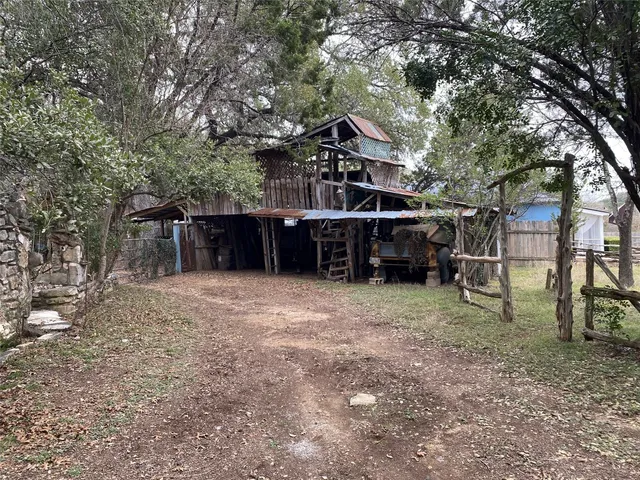 a backyard of a house with lots of green space