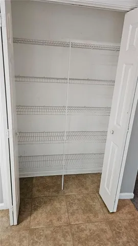 a view of a room with racks on the wall