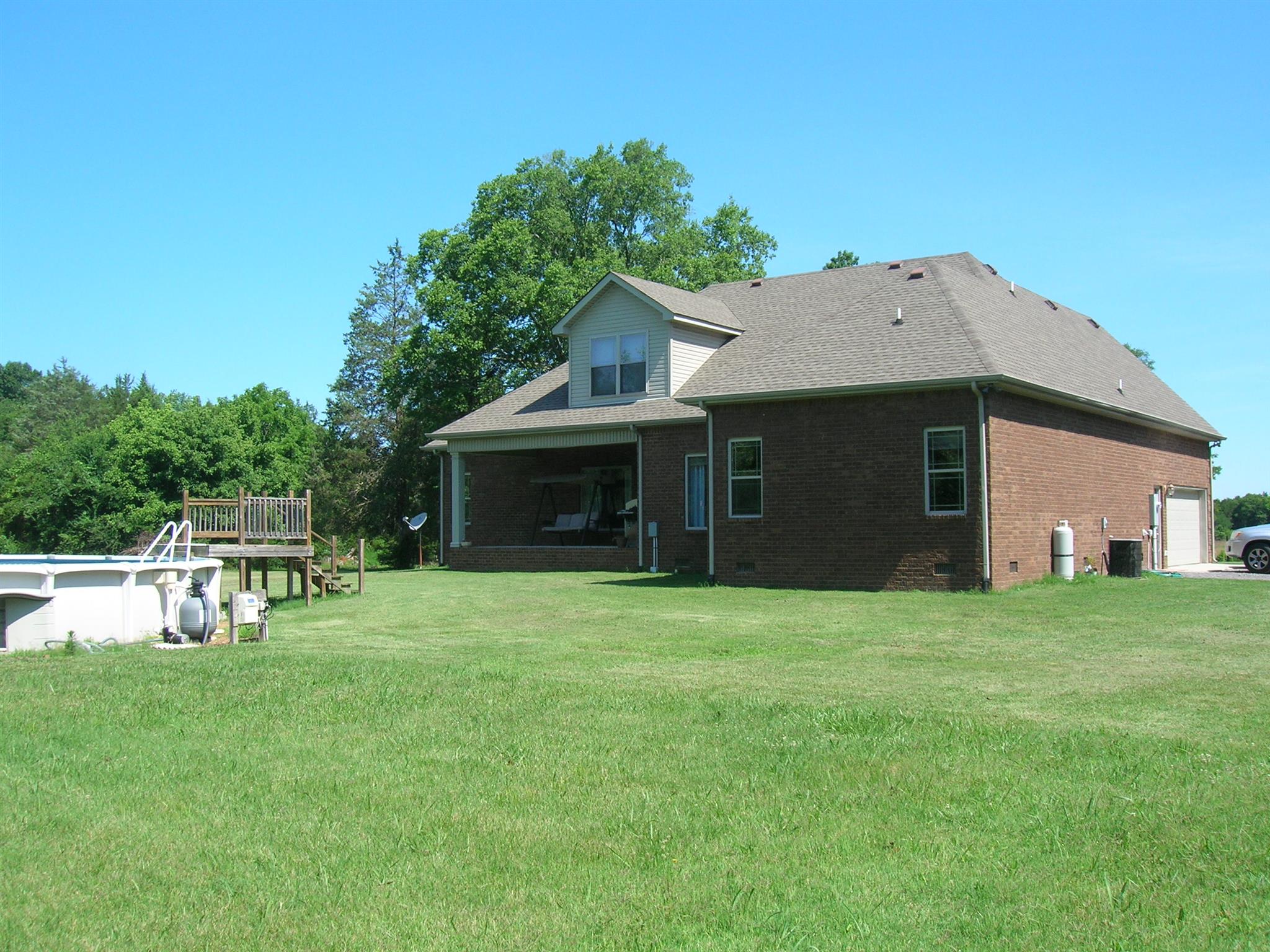 656 Crescent Road Murfreesboro, TN 37128 - Photo 12 of 15 a front view of a house with a garden and trees