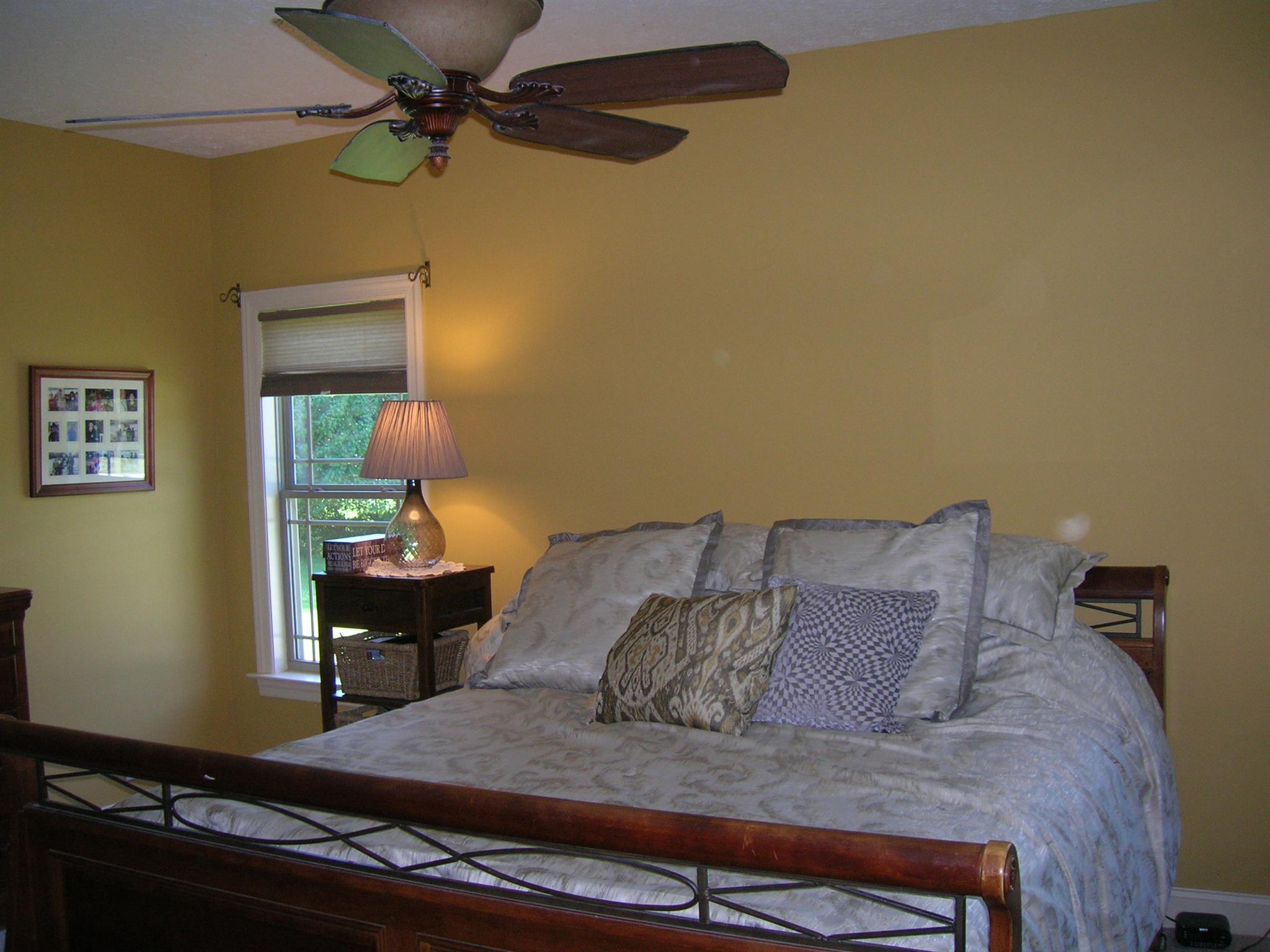 656 Crescent Road Murfreesboro, TN 37128 - Photo 7 of 15 a bed sitting in a bedroom next to a window