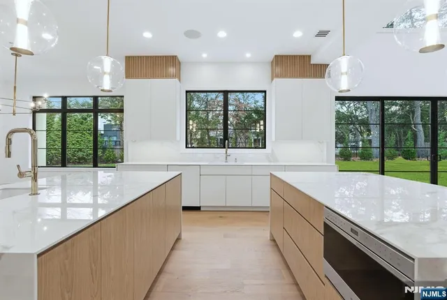 a kitchen with a sink and large window
