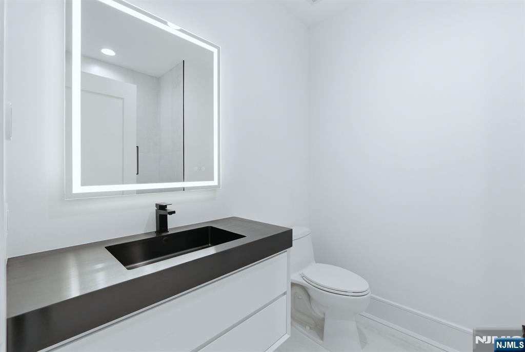 12 Irene Court Demarest, NJ 07627 - Photo 31 of 49 a bathroom with a sink and a toilet