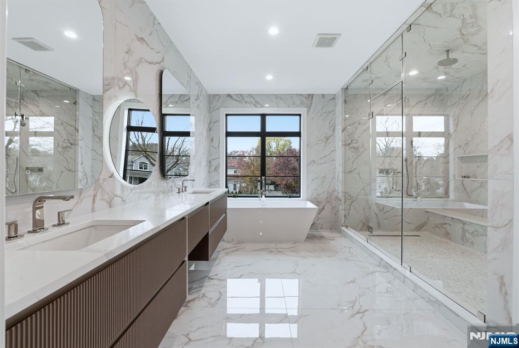 12 Irene Court Demarest, NJ 07627 - Photo 35 of 49 a large bathroom with a large tub and shower