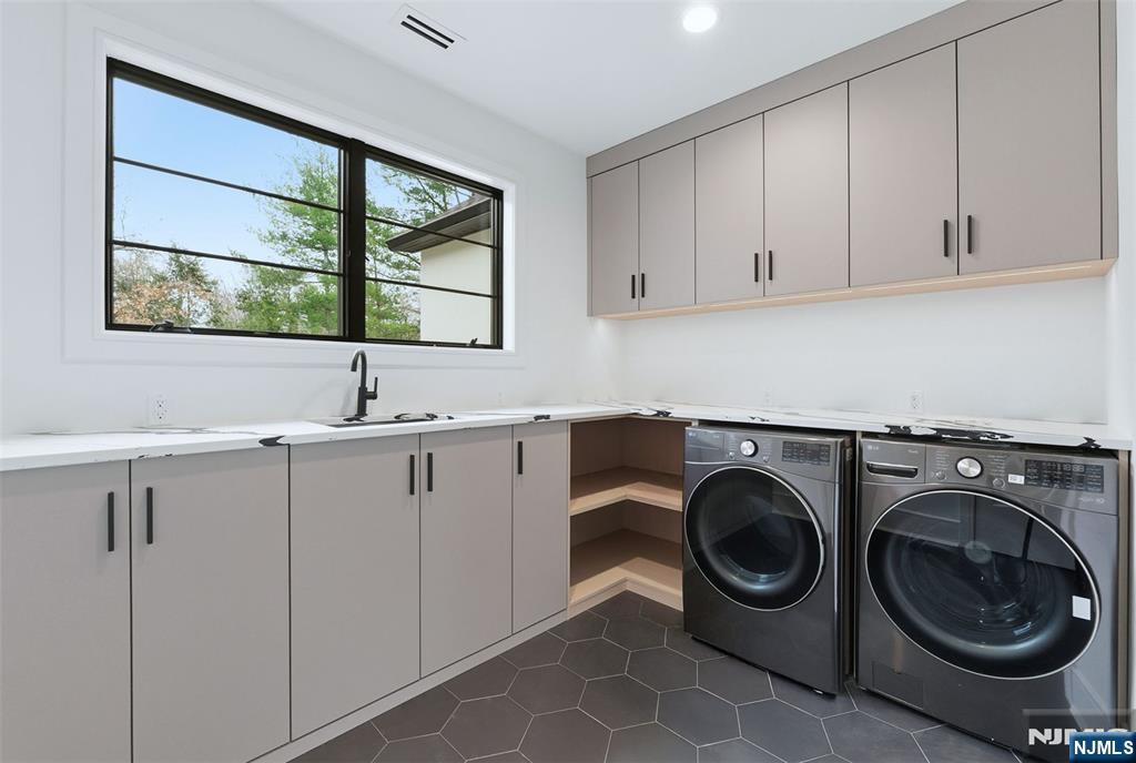 12 Irene Court Demarest, NJ 07627 - Photo 40 of 49 a utility room with sink dryer and washer