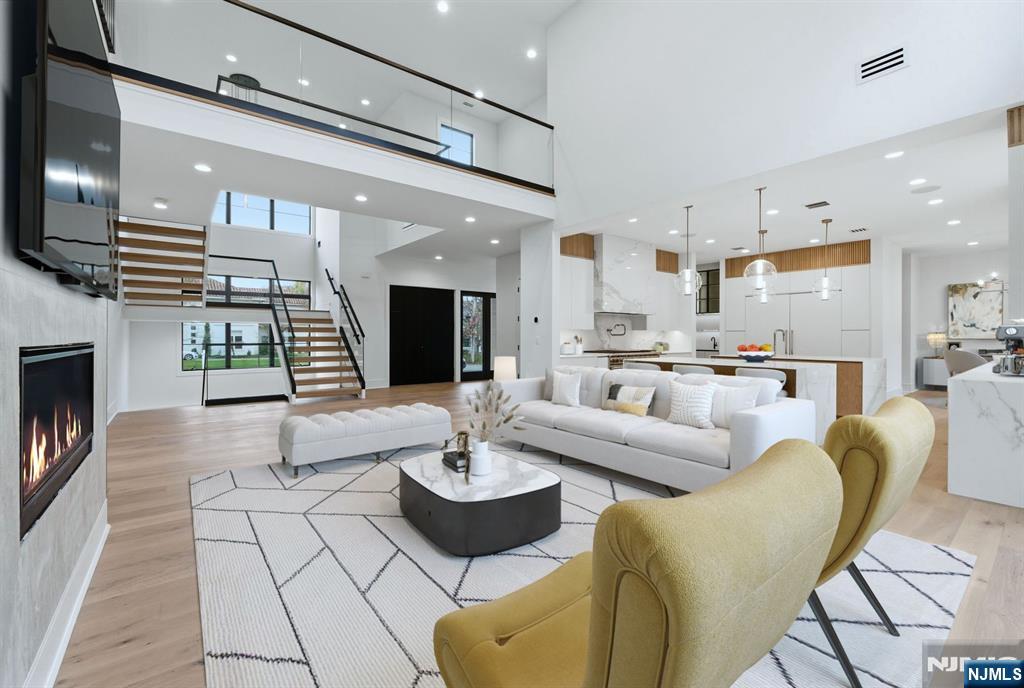 12 Irene Court Demarest, NJ 07627 - Photo 4 of 49 a living room with furniture kitchen view and a wooden floor