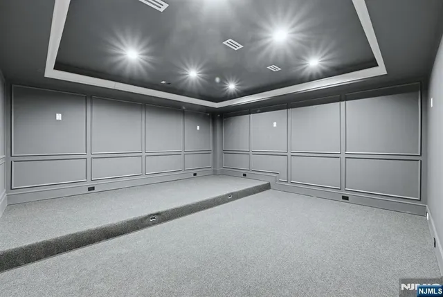 a view of an empty room with a projector
