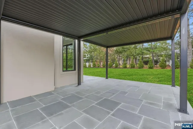 a view of a house with backyard and porch