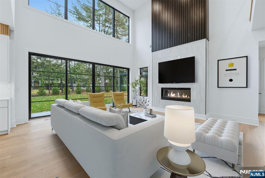 12 Irene Court Demarest, NJ 07627 - Photo 5 of 49 a living room with fireplace furniture and a flat screen tv