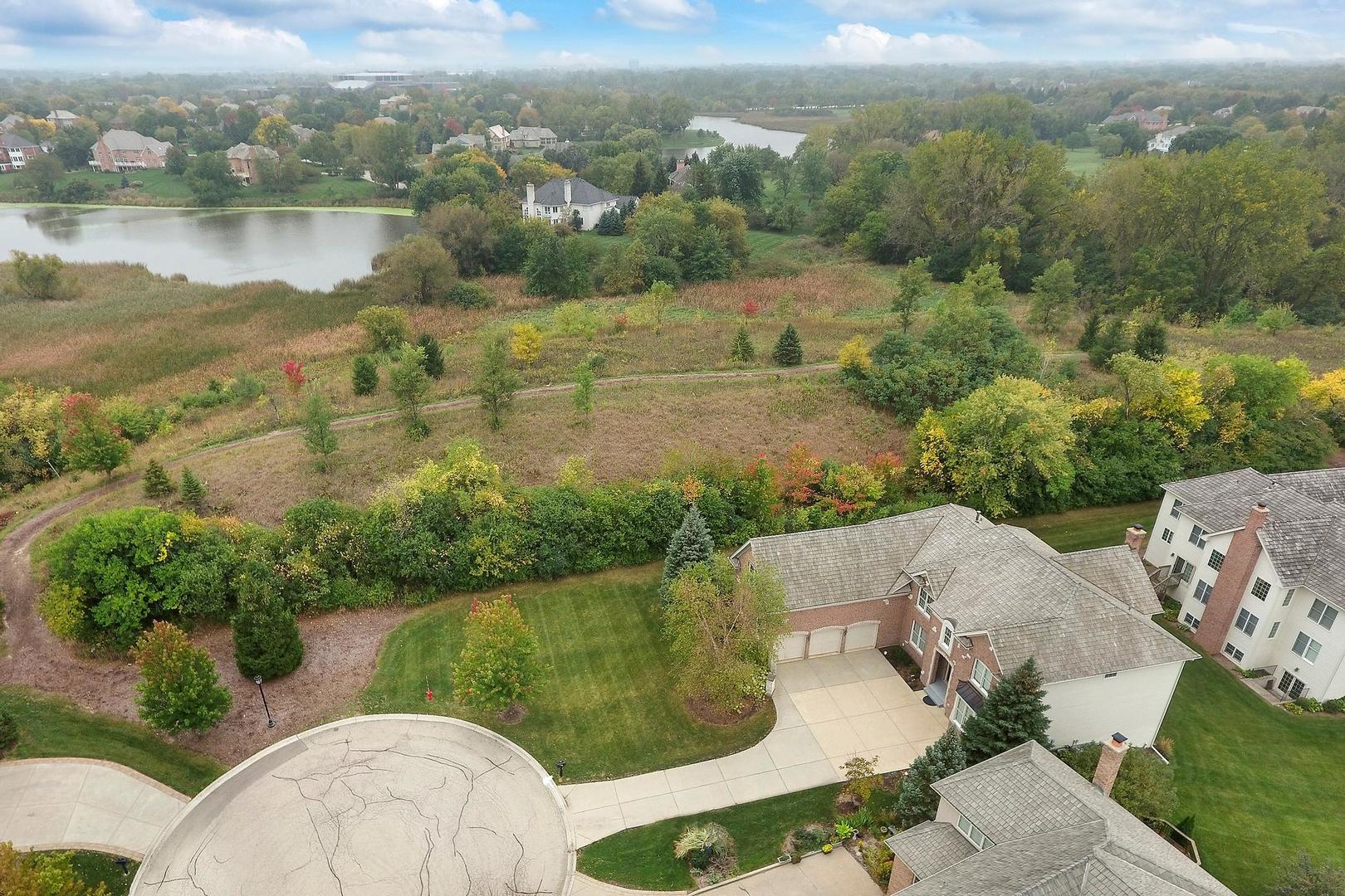 807 Poplar Court Inverness, IL 60010 - Photo 3 of 49 an aerial view of a house with a yard and lake view