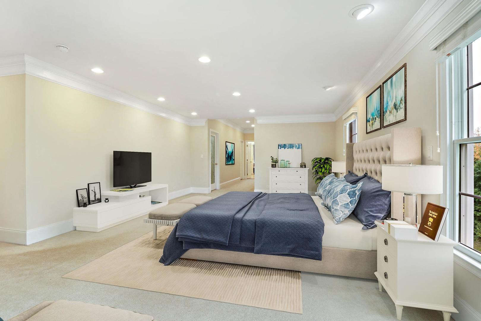 807 Poplar Court Inverness, IL 60010 - Photo 23 of 49 a spacious bedroom with a bed a couch and a flat screen tv