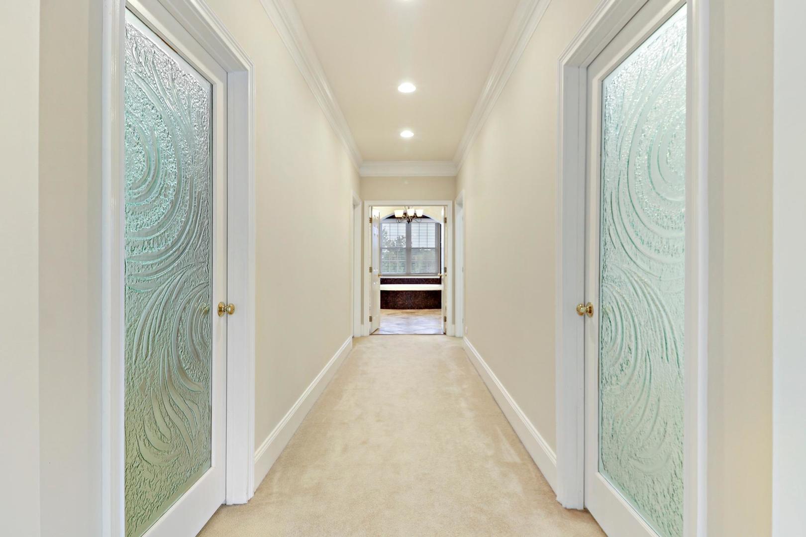 807 Poplar Court Inverness, IL 60010 - Photo 24 of 49 a view of a hallway with wooden floor and a bathroom