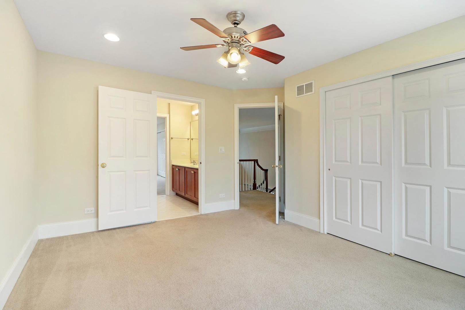 807 Poplar Court Inverness, IL 60010 - Photo 29 of 49 a view of a livingroom with a chandelier fan