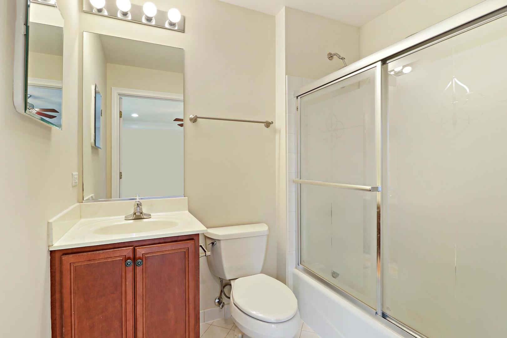 807 Poplar Court Inverness, IL 60010 - Photo 31 of 49 a bathroom with a sink a toilet and shower