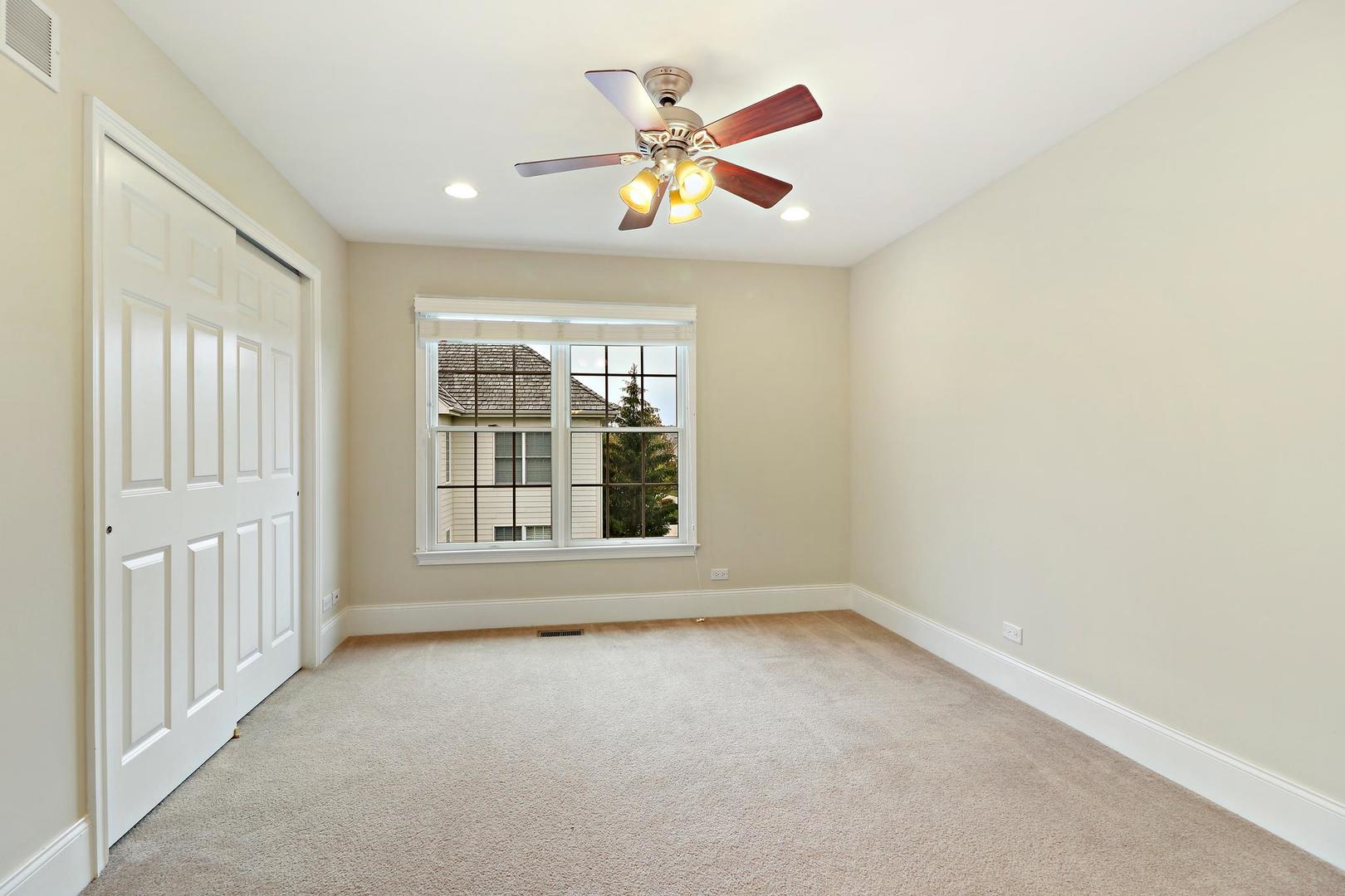 807 Poplar Court Inverness, IL 60010 - Photo 33 of 49 a view of an empty room with a window