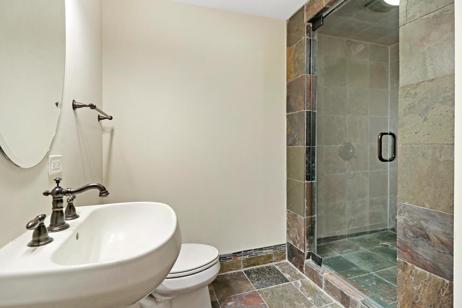 807 Poplar Court Inverness, IL 60010 - Photo 42 of 49 a bathroom with a sink toilet and shower