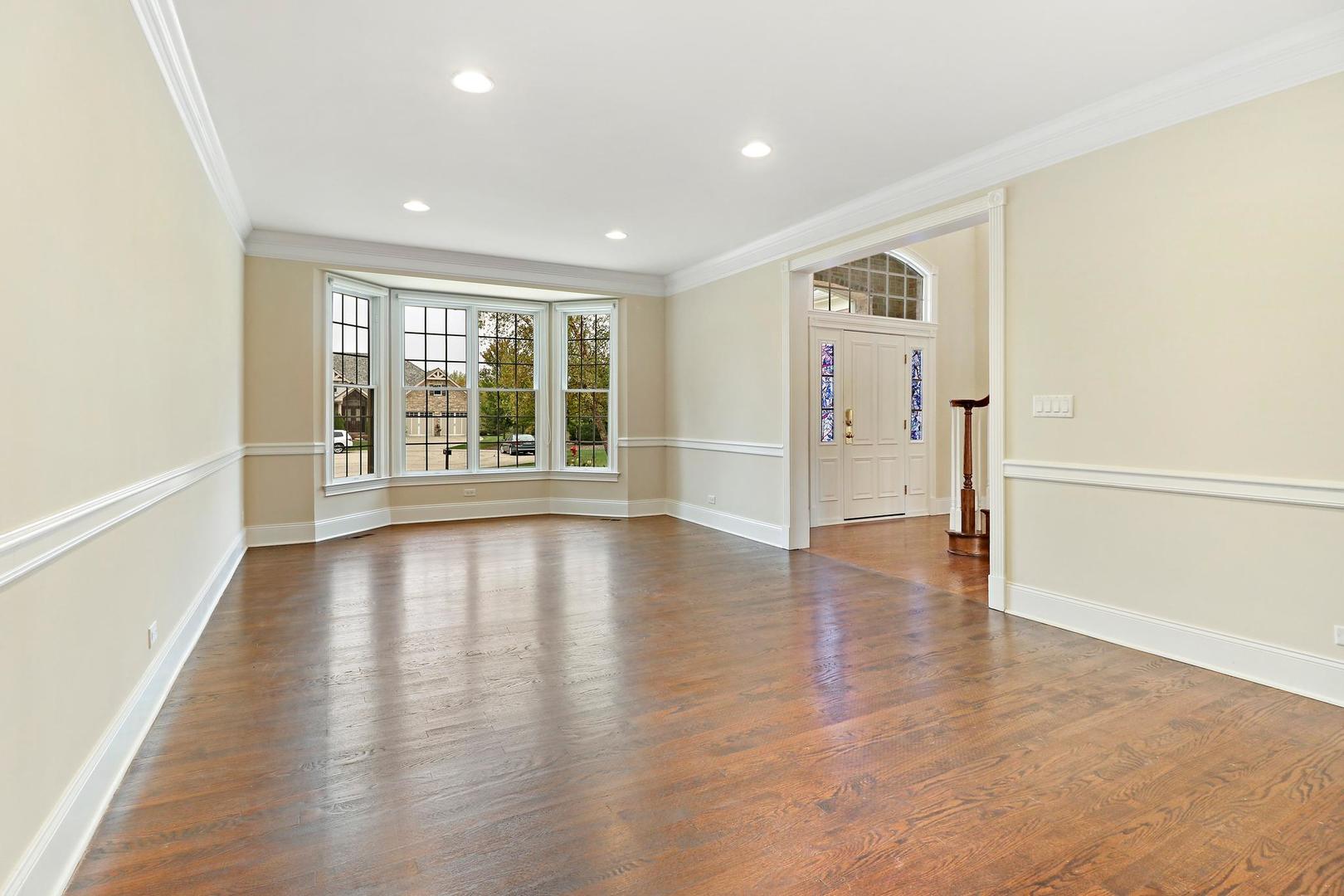 807 Poplar Court Inverness, IL 60010 - Photo 6 of 49 an empty room with wooden floor and windows