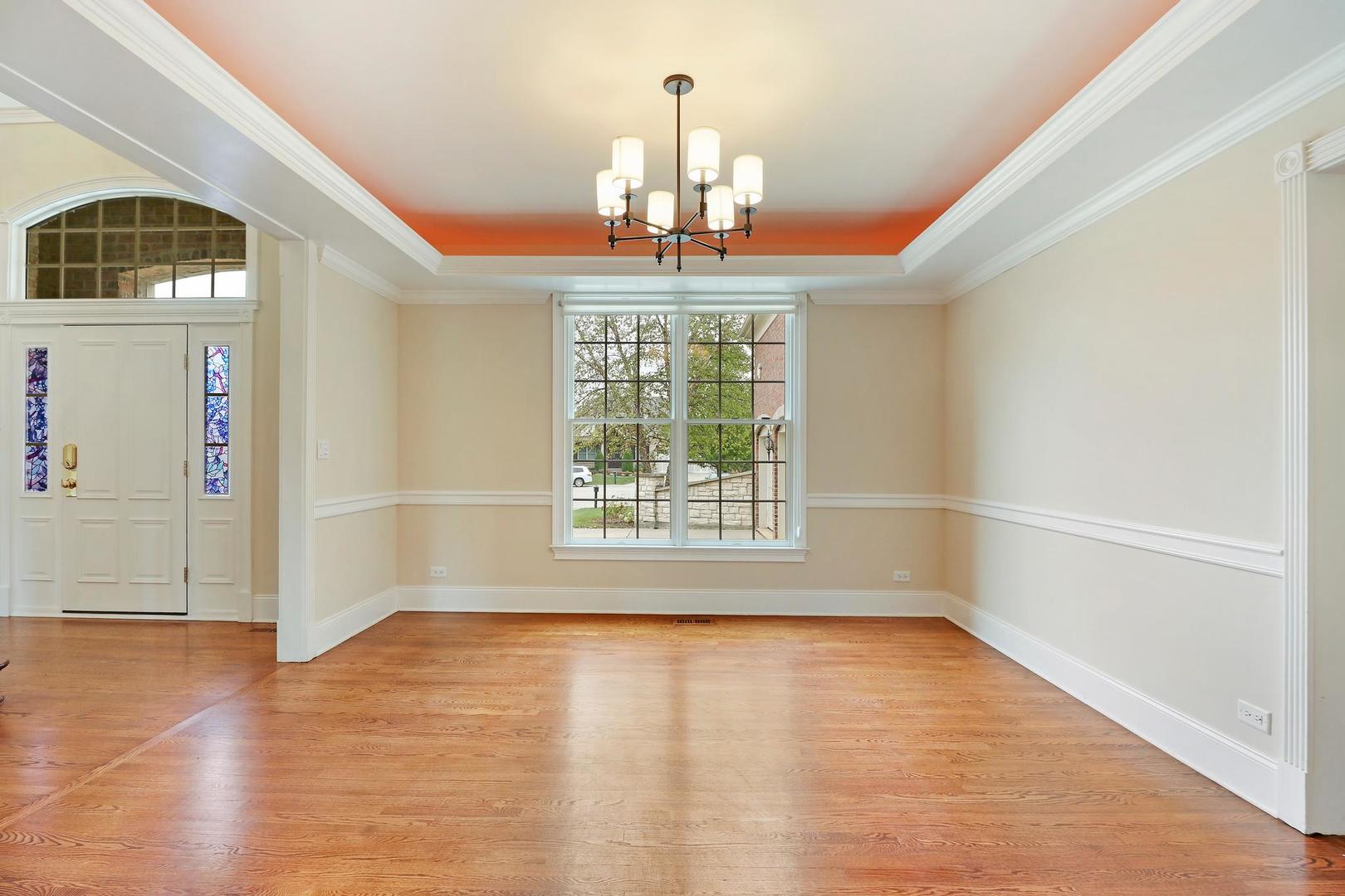 807 Poplar Court Inverness, IL 60010 - Photo 8 of 49 a view of an empty room with wooden floor and a window