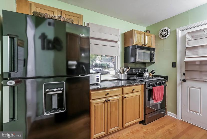 5602 Norton Road Alexandria, VA 22303 - Photo 7 of 25 Upgraded kitchen with granite and new appliances