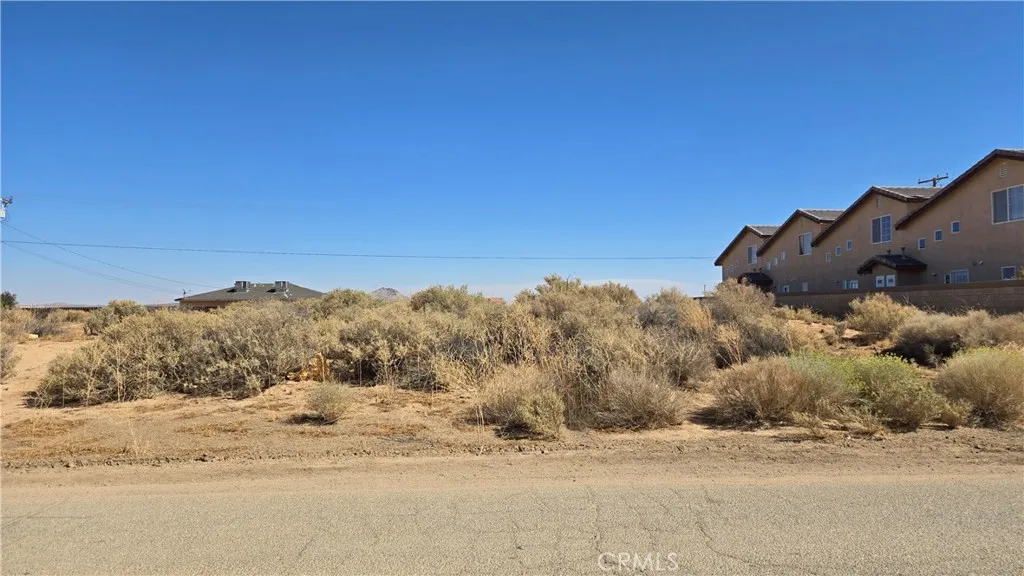 0 98th Street Edwards, CA 93523 - Photo 10 of 12 a view of a road with a building in the background