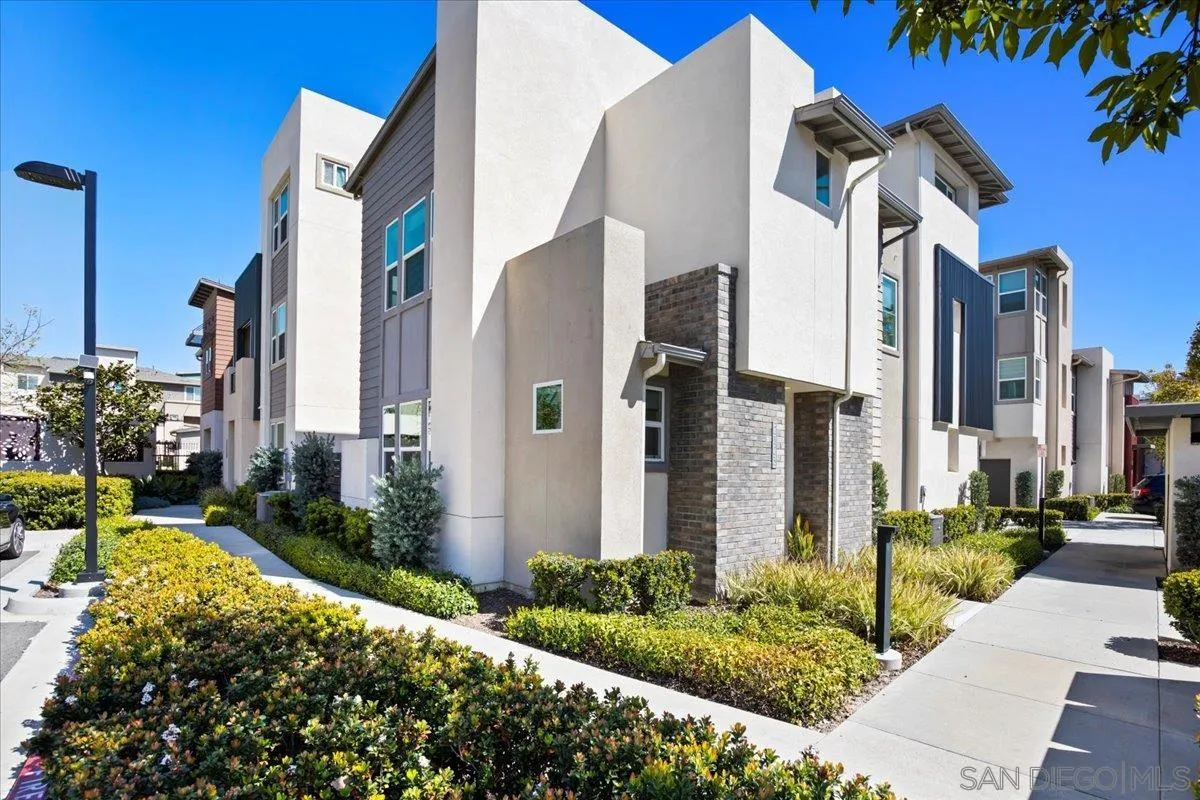 a front view of a building with a garden