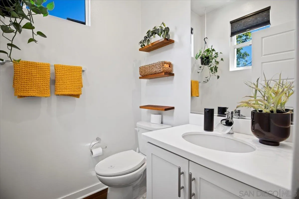 2123 Element Way Chula Vista, CA 91915 - Photo 20 of 42 a bathroom with a sink a toilet and mirror