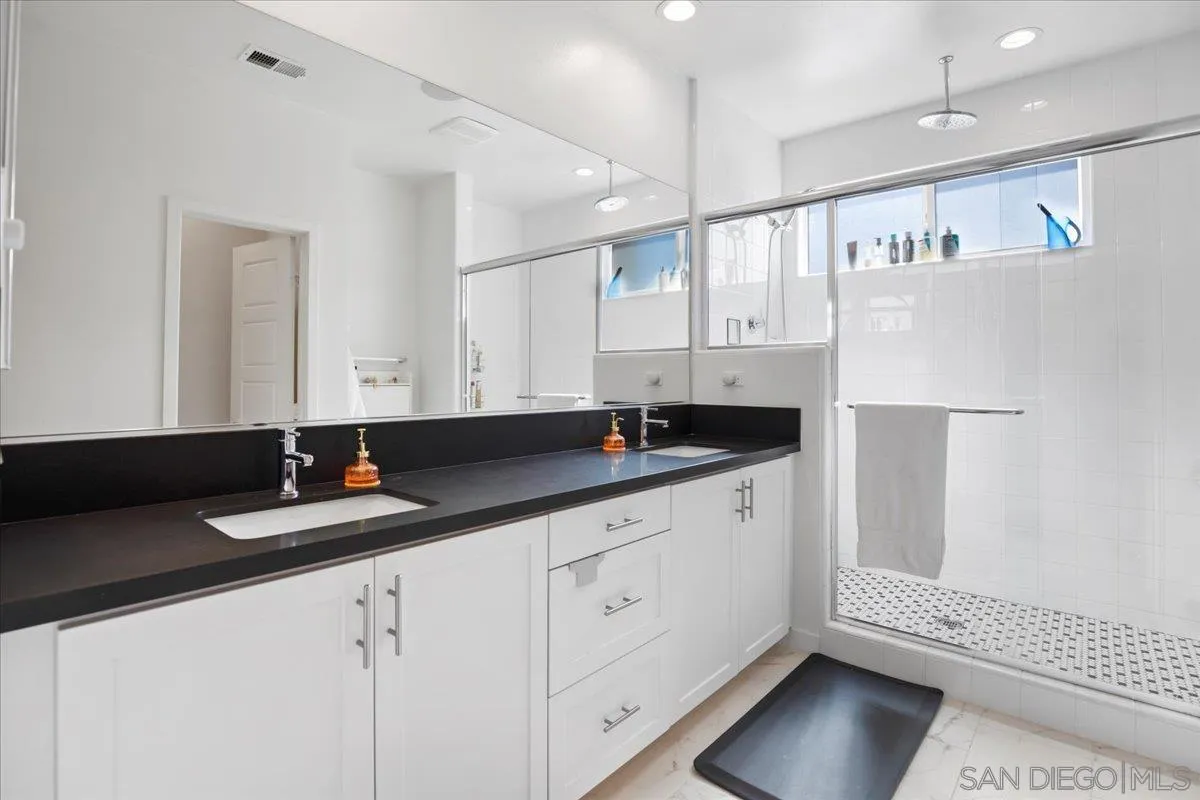 2123 Element Way Chula Vista, CA 91915 - Photo 27 of 42 a bathroom with a sink and a mirror