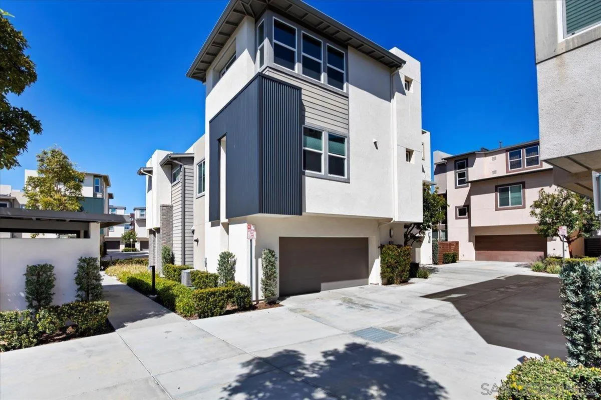 2123 Element Way Chula Vista, CA 91915 - Photo 3 of 42 a front view of a house with a yard