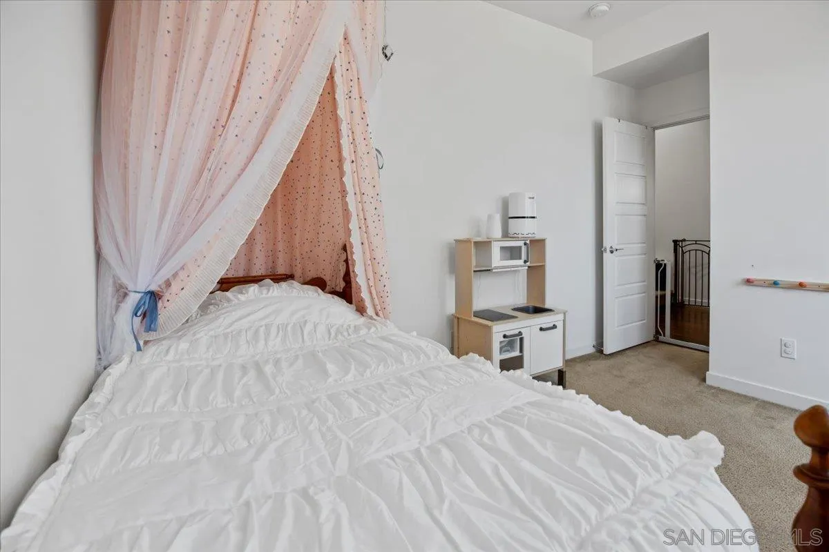 2123 Element Way Chula Vista, CA 91915 - Photo 31 of 42 a bedroom with a bed and a chair