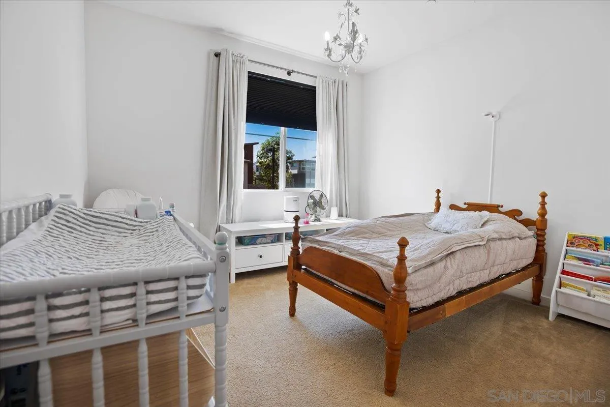 2123 Element Way Chula Vista, CA 91915 - Photo 32 of 42 a bedroom with a bed and a flat screen tv