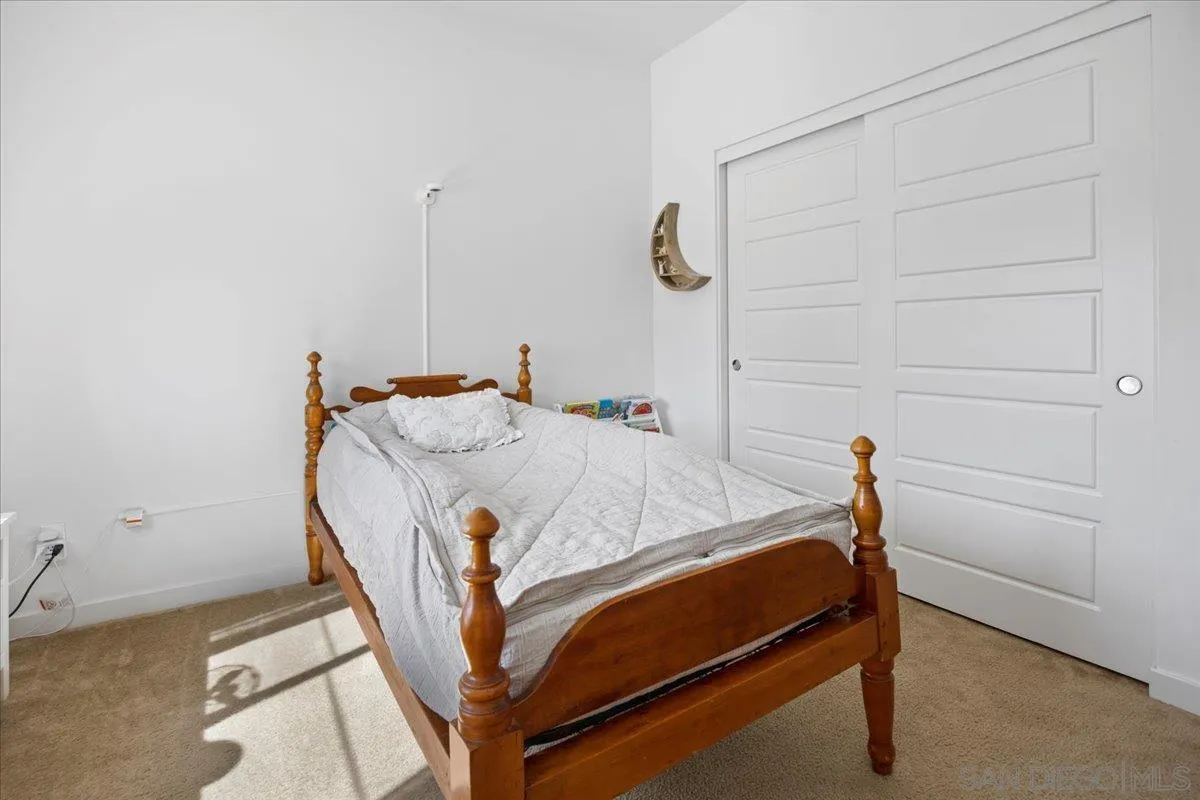 2123 Element Way Chula Vista, CA 91915 - Photo 33 of 42 a bed sitting in a bedroom next to a window