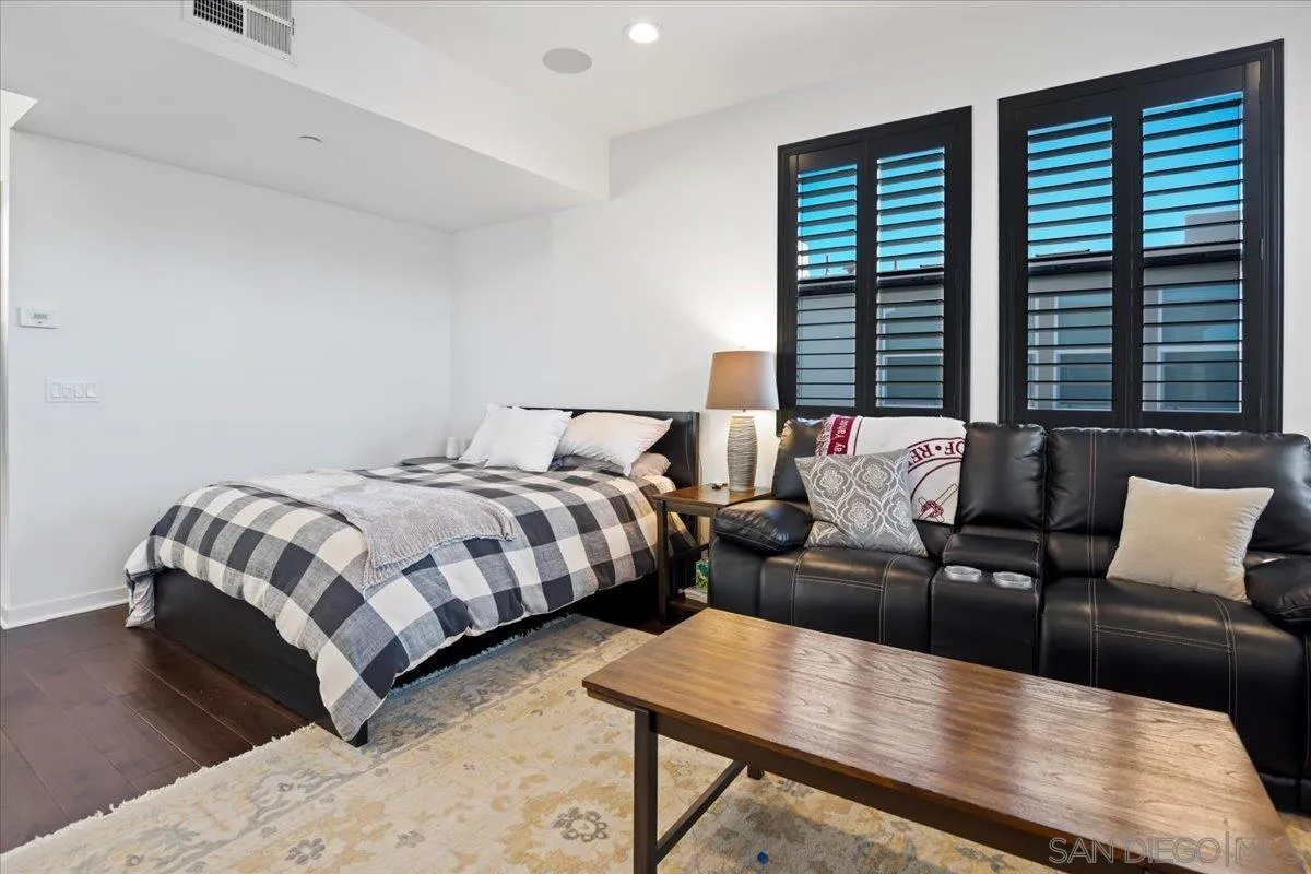 2123 Element Way Chula Vista, CA 91915 - Photo 36 of 42 a bedroom with a bed a couch and a large window